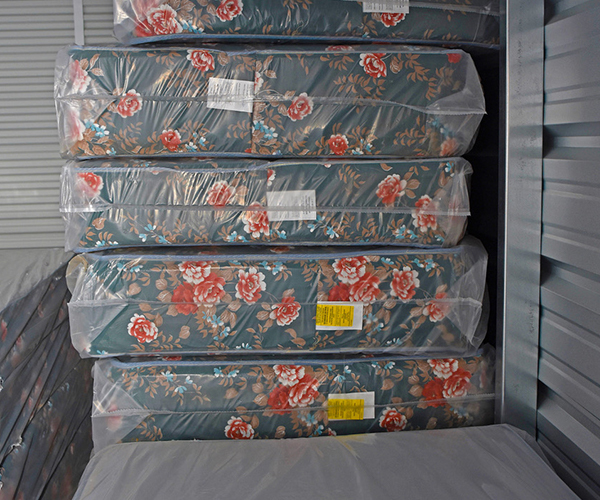 Mattresses stacked vertically