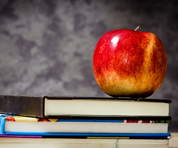 Apple on stack of books