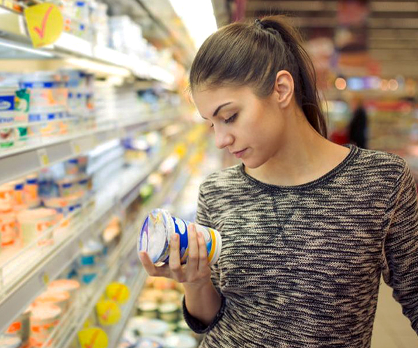 Woman reading food label